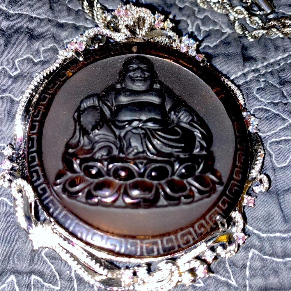 Sterling Silver Buddha centered around Pink Rhinestones with a braided chain